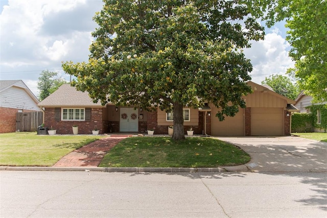 2728 Kerry Ln, Oklahoma City, OK 73120 - view of front of property with brick siding, driveway, and a garage