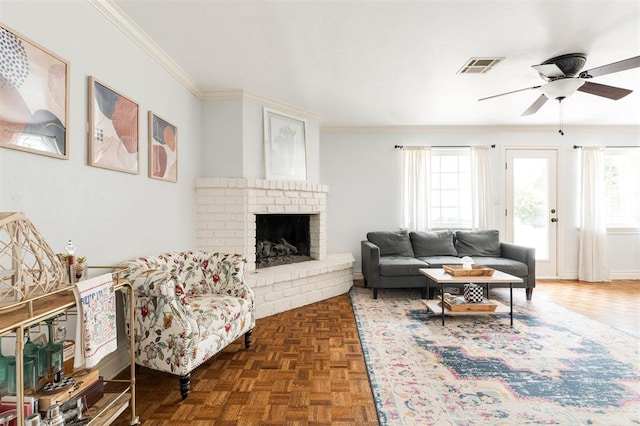 2728 Kerry Ln, Oklahoma City, OK 73120 - living area featuring plenty of natural light, a fireplace, crown molding, and ceiling fan
