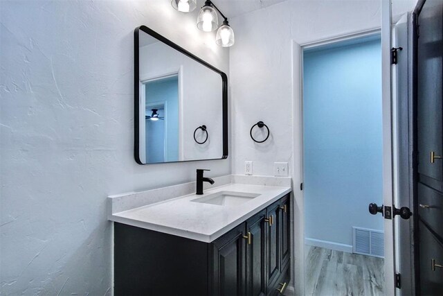 2528 Oakridge Dr, Bethany, OK 73008 - bathroom featuring vanity and wood finished floors