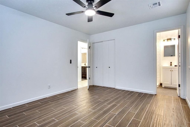 2528 Oakridge Dr, Bethany, OK 73008 - unfurnished bedroom featuring dark wood-style floors, baseboards, a closet, and ensuite bathroom
