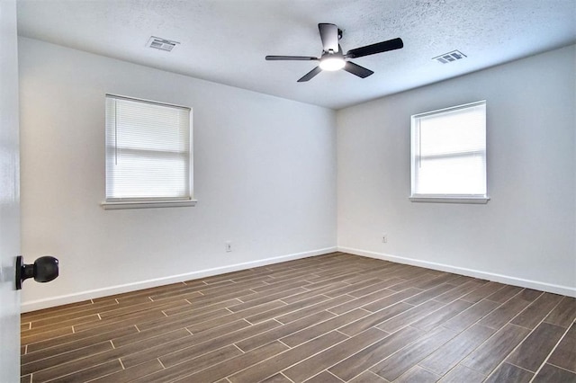 2528 Oakridge Dr, Bethany, OK 73008 - empty room featuring dark wood-type flooring, ceiling fan, and baseboards