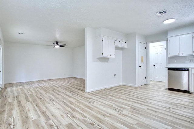 2528 Oakridge Dr, Bethany, OK 73008 - unfurnished living room with light wood-type flooring, a ceiling fan, baseboards, and a textured ceiling