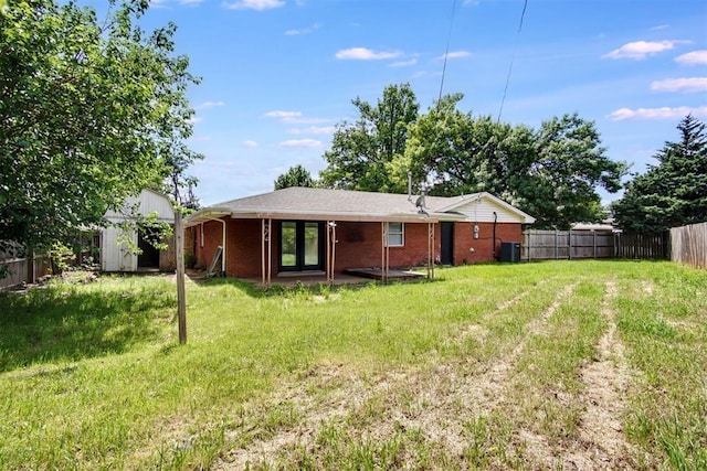 2528 Oakridge Dr, Bethany, OK 73008 - back of house featuring central air condition unit, french doors, brick siding, a storage shed, and an outdoor structure
