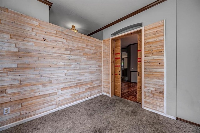 2105 SW 124th St, Oklahoma City, OK 73170 - spare room featuring crown molding, carpet, wood walls, and baseboards