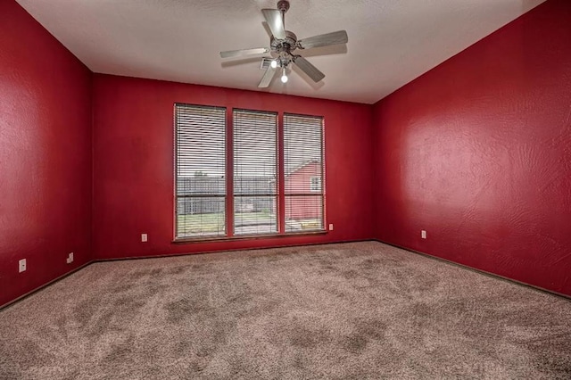 2105 SW 124th St, Oklahoma City, OK 73170 - carpeted empty room featuring a ceiling fan and baseboards