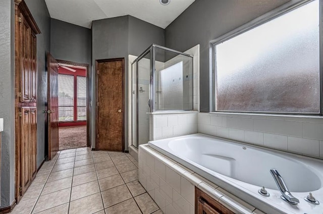 2105 SW 124th St, Oklahoma City, OK 73170 - full bathroom featuring a stall shower, a garden tub, and tile patterned flooring