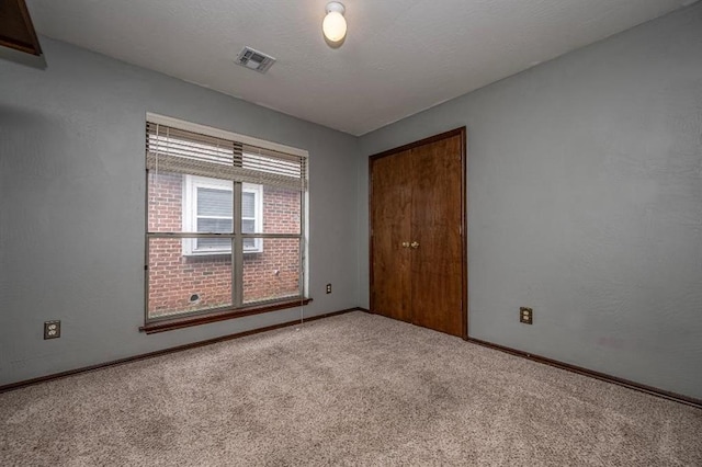 2105 SW 124th St, Oklahoma City, OK 73170 - empty room featuring carpet floors and baseboards