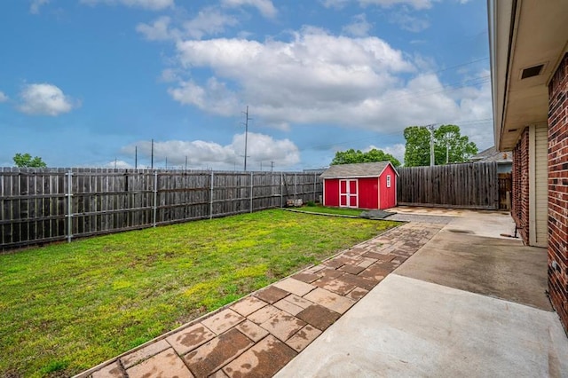 2105 SW 124th St, Oklahoma City, OK 73170 - view of yard with a patio area, a storage unit, an outbuilding, and driveway