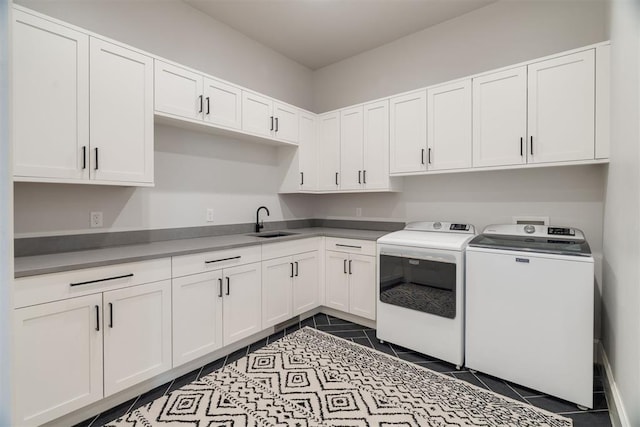 909 NW 156th St, Edmond, OK 73013 - laundry room featuring washer and dryer, cabinet space, and dark tile patterned floors