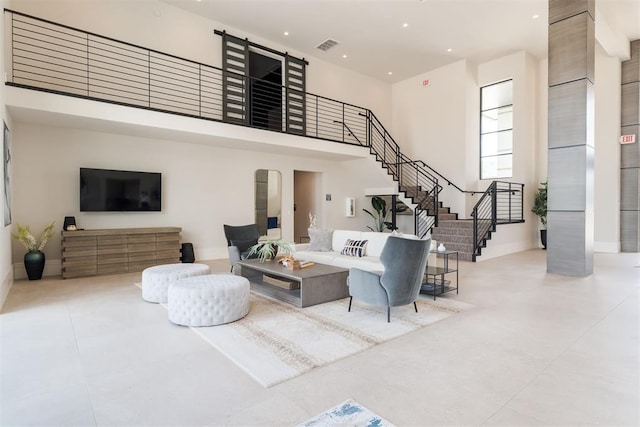 909 NW 156th St, Edmond, OK 73013 - living room featuring stairway, a high ceiling, baseboards, and recessed lighting