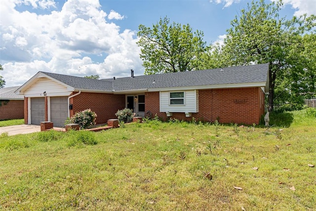 single story home with brick siding, a garage, a front yard, and concrete driveway