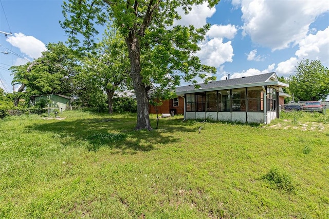 view of yard with a sunroom