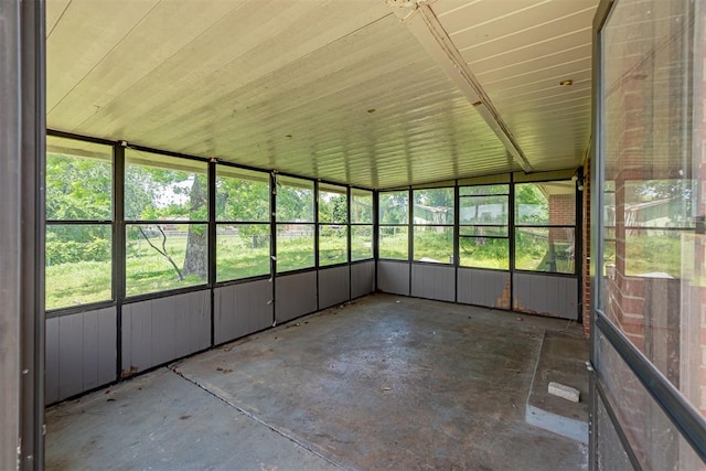 unfurnished sunroom with plenty of natural light