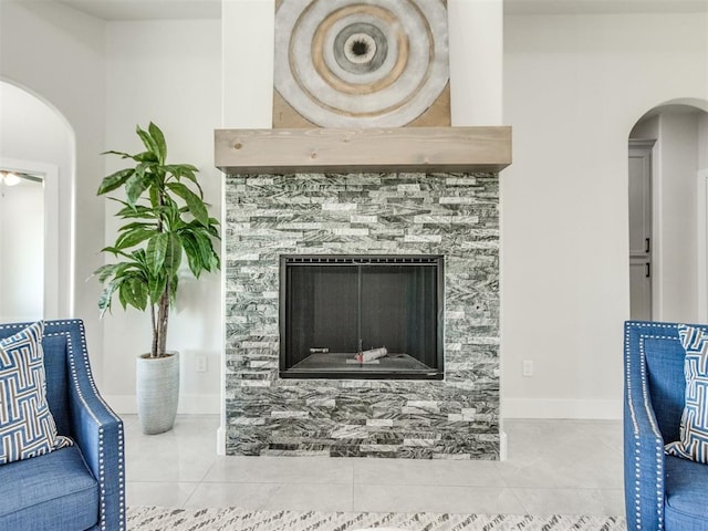 4850 Ranchero Dr, Edmond, OK 73025 - detailed view of arched walkways, a fireplace, and baseboards