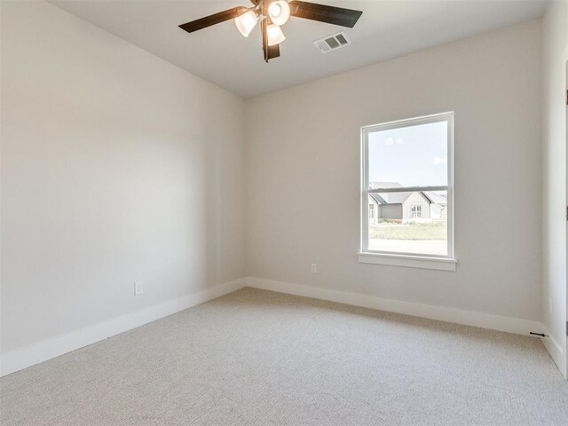 4850 Ranchero Dr, Edmond, OK 73025 - empty room with light colored carpet, ceiling fan, and baseboards