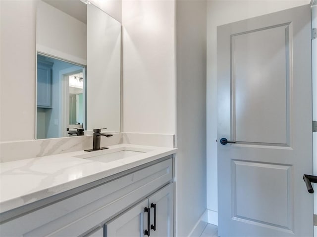4850 Ranchero Dr, Edmond, OK 73025 - bathroom with vanity and baseboards