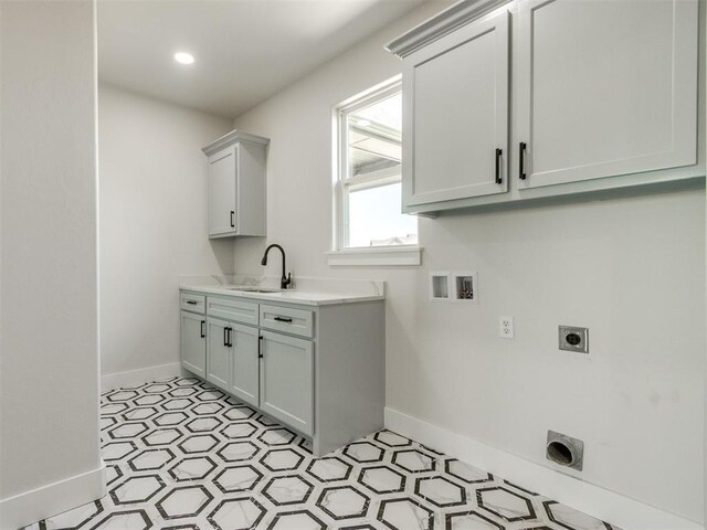 4850 Ranchero Dr, Edmond, OK 73025 - clothes washing area featuring hookup for an electric dryer, hookup for a washing machine, baseboards, and light flooring