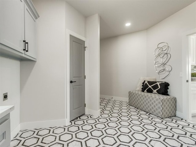 4850 Ranchero Dr, Edmond, OK 73025 - laundry area featuring cabinet space, baseboards, light floors, hookup for an electric dryer, and recessed lighting