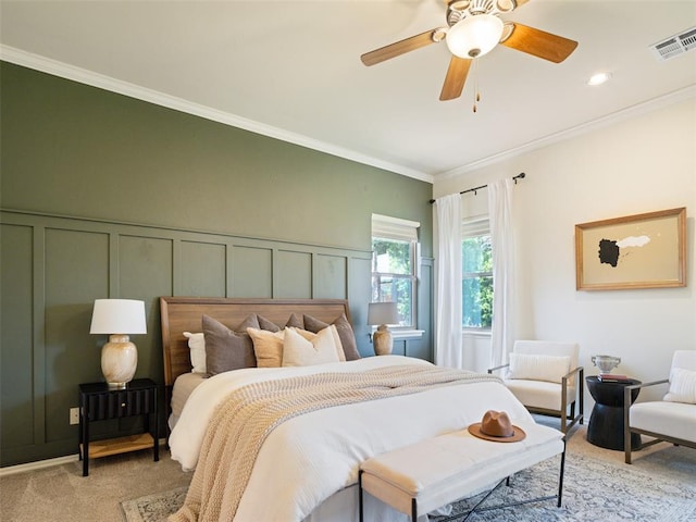 bedroom featuring light carpet, crown molding, and ceiling fan