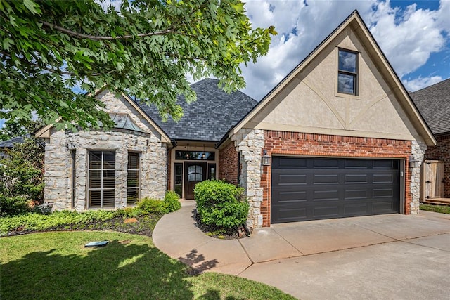 view of front of home featuring concrete driveway, stone siding, and brick siding