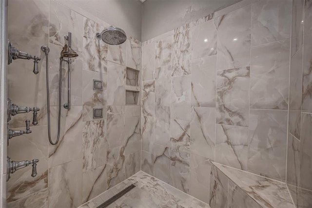 full bathroom featuring tiled shower