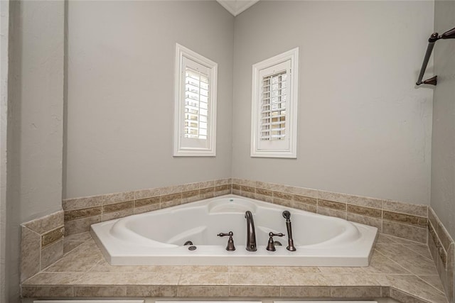 bathroom with a garden tub