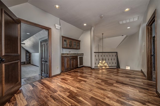 additional living space with lofted ceiling, dark wood-style floors, baseboards, wine cooler, and recessed lighting