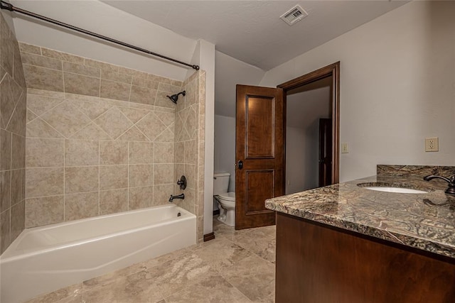 full bath featuring toilet, bathtub / shower combination, vanity, and marble finish floors