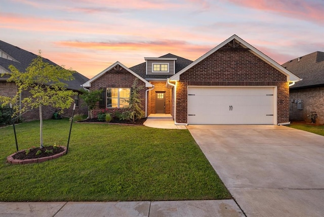9117 NW 123rd St, Yukon, OK 73099 - traditional home featuring brick siding, driveway, an attached garage, and a yard