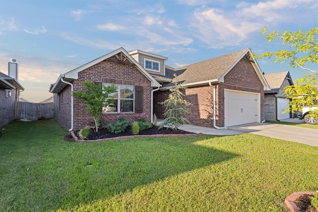 9117 NW 123rd St, Yukon, OK 73099 - view of front facade featuring brick siding, driveway, a garage, and a shingled roof
