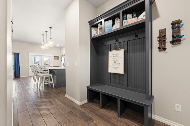 9117 NW 123rd St, Yukon, OK 73099 - mudroom featuring baseboards and dark wood finished floors