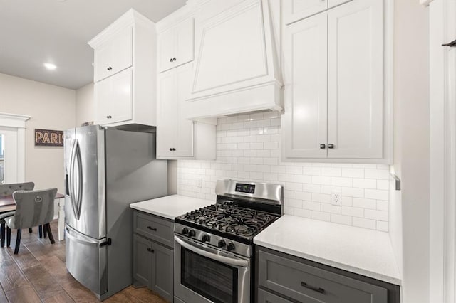 9117 NW 123rd St, Yukon, OK 73099 - kitchen featuring appliances with stainless steel finishes, gray cabinets, light countertops, and backsplash