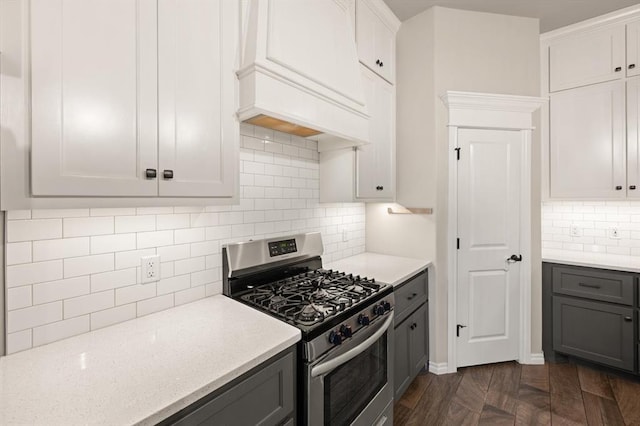 9117 NW 123rd St, Yukon, OK 73099 - kitchen featuring stainless steel gas stove, gray cabinetry, backsplash, and custom range hood