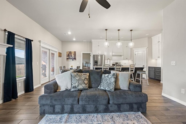 9117 NW 123rd St, Yukon, OK 73099 - living room featuring recessed lighting, dark wood-type flooring, ceiling fan, and baseboards