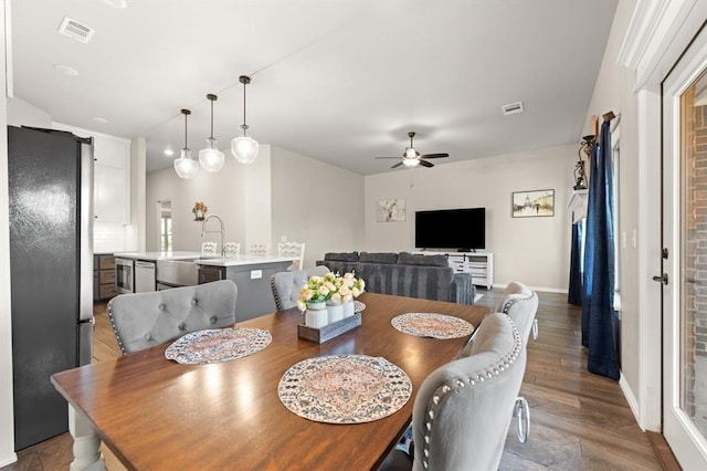9117 NW 123rd St, Yukon, OK 73099 - dining space featuring a ceiling fan, baseboards, and wood finished floors