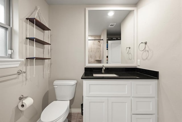9117 NW 123rd St, Yukon, OK 73099 - bathroom featuring toilet, baseboards, and vanity