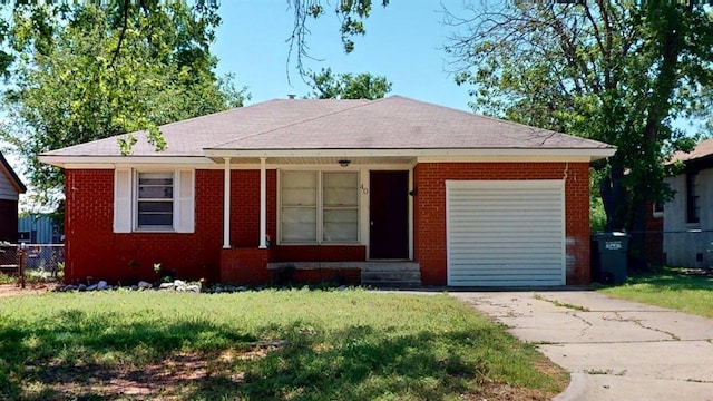 40 E 14th St, Edmond, OK 73034 - ranch-style house featuring entry steps, brick siding, a shingled roof, and concrete driveway