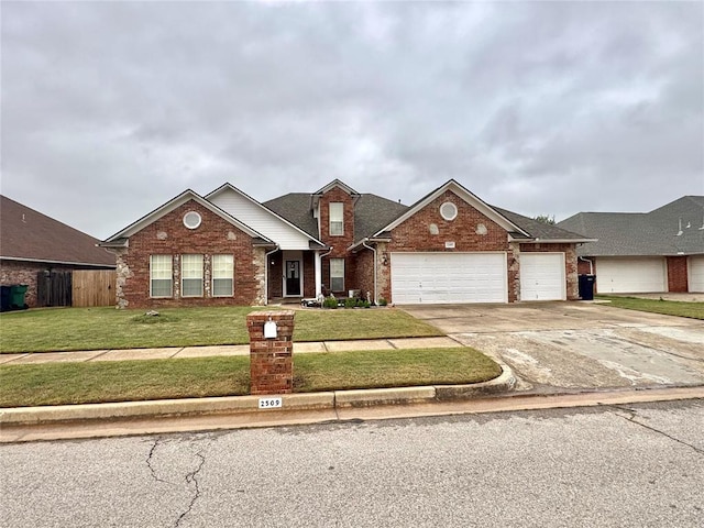 traditional-style house featuring brick siding, concrete driveway, and a garage