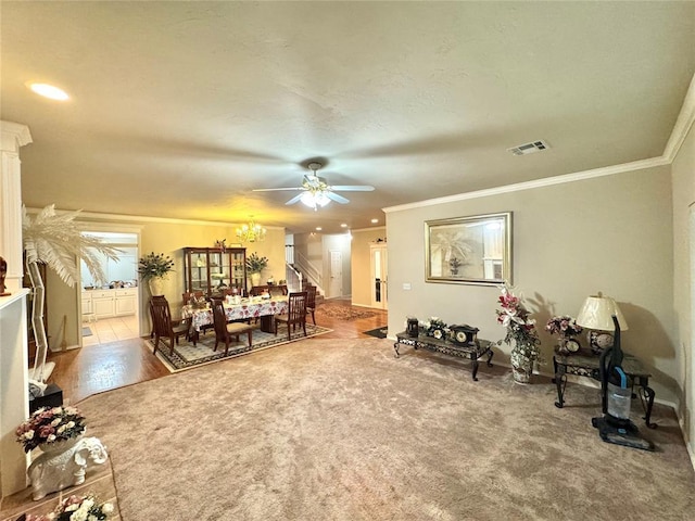 living area featuring crown molding, ceiling fan, stairs, a chandelier, and recessed lighting