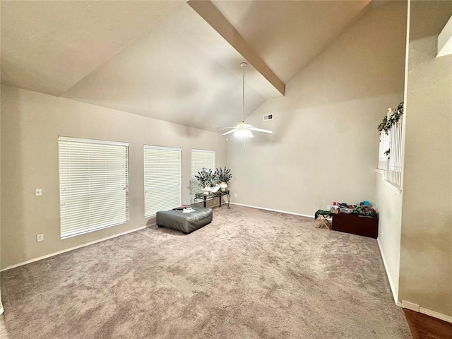 unfurnished room featuring carpet floors, a ceiling fan, baseboards, and high vaulted ceiling