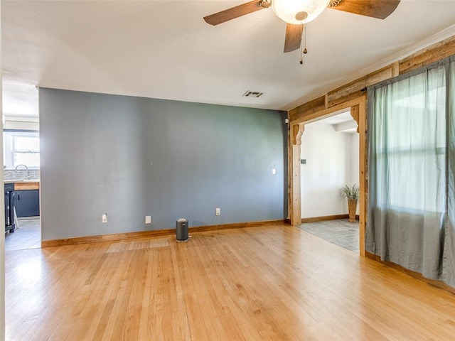 3208 NW 34th St, Oklahoma City, OK 73112 - spare room with hardwood / wood-style floors, ceiling fan, and baseboards