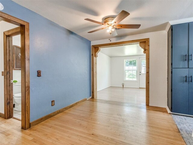 3208 NW 34th St, Oklahoma City, OK 73112 - empty room with a ceiling fan, light wood-style floors, and baseboards