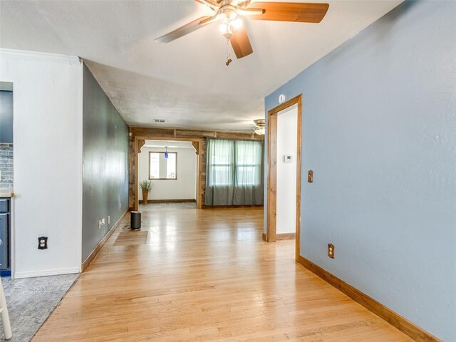 3208 NW 34th St, Oklahoma City, OK 73112 - spare room with ceiling fan, light wood-style floors, and baseboards