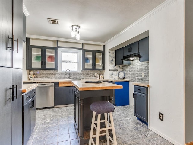 3208 NW 34th St, Oklahoma City, OK 73112 - kitchen with dishwasher, butcher block counters, tasteful backsplash, and crown molding