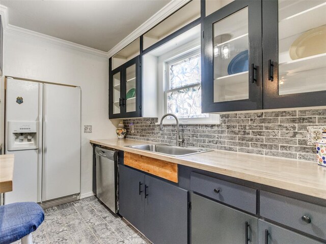 3208 NW 34th St, Oklahoma City, OK 73112 - kitchen with white refrigerator with ice dispenser, dishwasher, a sink, ornamental molding, and backsplash