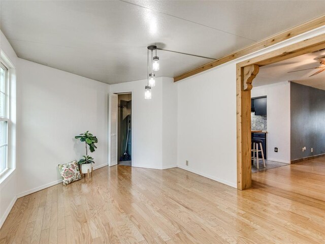 3208 NW 34th St, Oklahoma City, OK 73112 - spare room featuring wood finished floors, ceiling fan, and baseboards