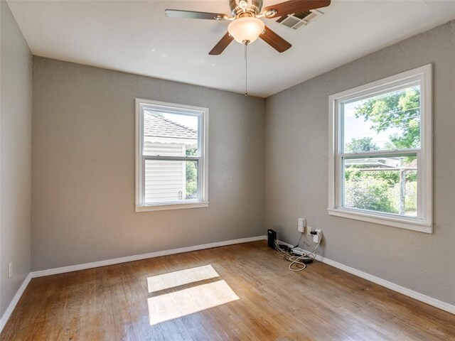 3208 NW 34th St, Oklahoma City, OK 73112 - empty room featuring wood finished floors, baseboards, and ceiling fan