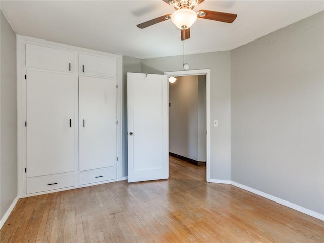 3208 NW 34th St, Oklahoma City, OK 73112 - unfurnished bedroom with light wood-style flooring, baseboards, a closet, and ceiling fan