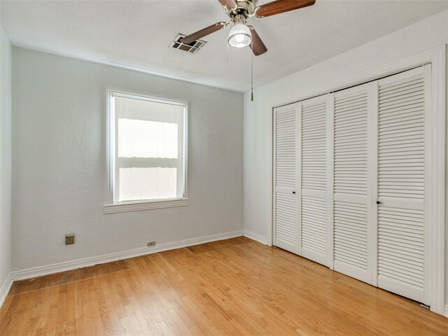 3208 NW 34th St, Oklahoma City, OK 73112 - unfurnished bedroom featuring baseboards, light wood-type flooring, a closet, and a ceiling fan