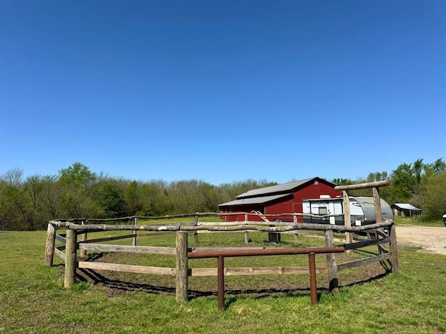 377056 E 1040th Rd, Okemah, OK 74859 - view of yard featuring an outbuilding, a pole building, and a wooded view